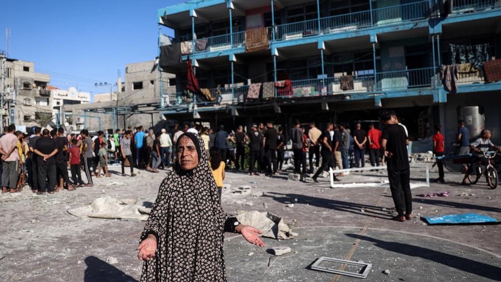 PHOTO: A Palestinian woman gestures at the courtyard of a school after an Israeli air strike hit the site, in Nuseirat in the central Gaza Strip on September 11, 2024, amid the ongoing war in the Palestinian territory between Israel and Hamas. 