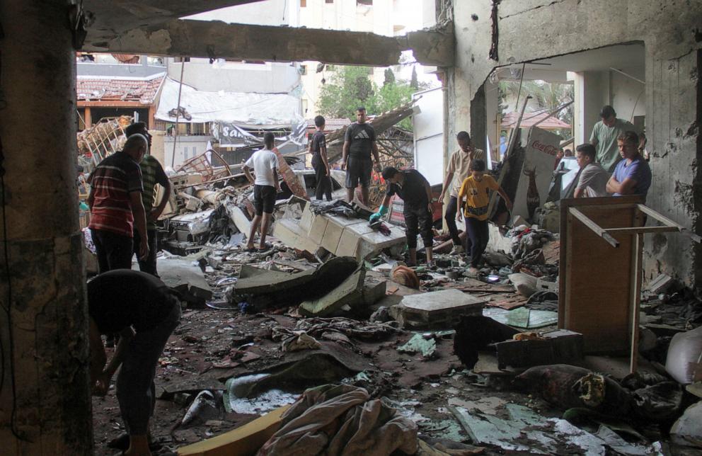 PHOTO: Palestinians look at the damage at the site of an Israeli strike on a school sheltering displaced people, amid the Israel-Hamas conflict, in Gaza City, Aug. 10, 2024. 