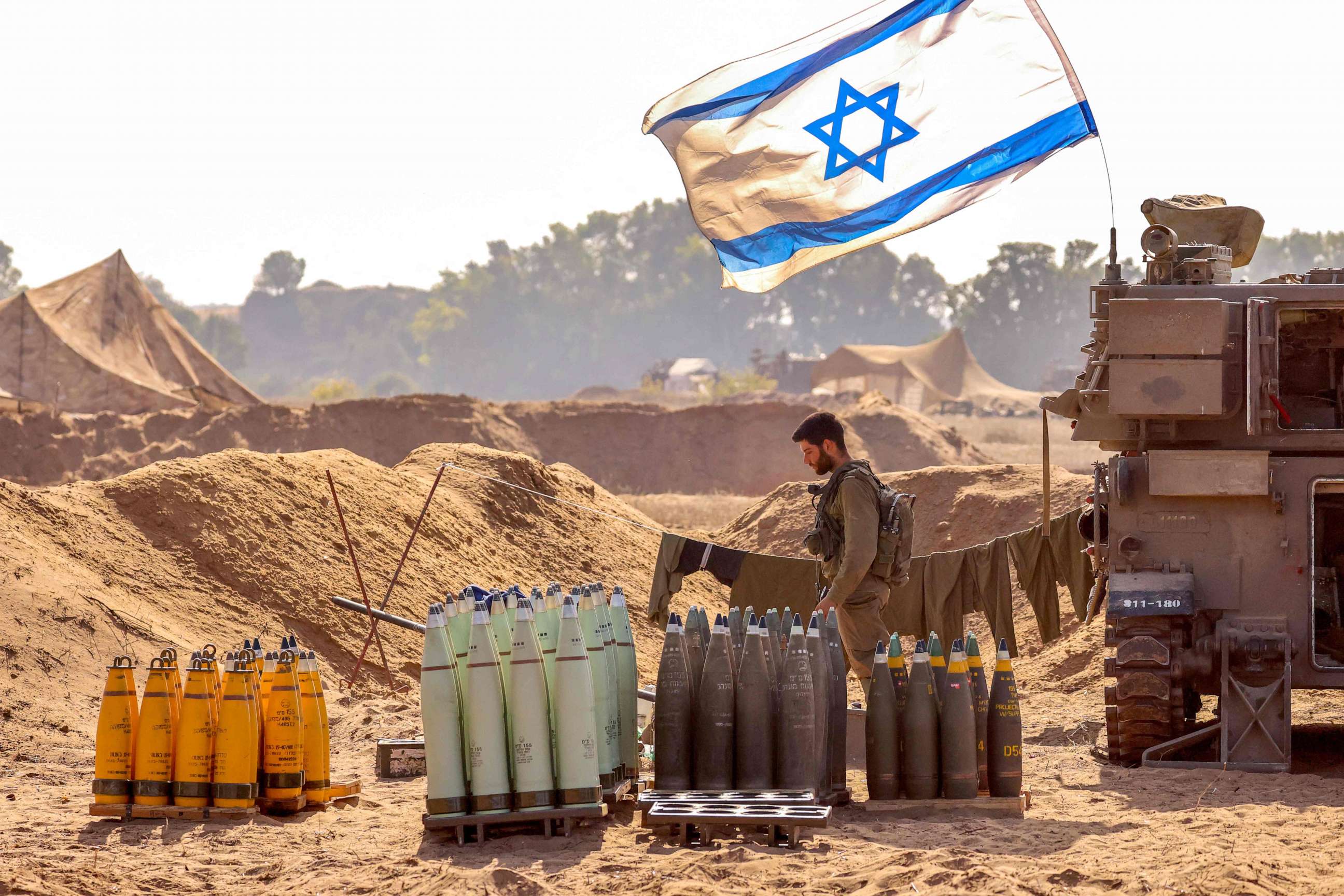 PHOTO: An Israeli soldier arranges artillery shells at a position near the border with the Gaza Strip in southern Israel on Nov. 6, 2023.