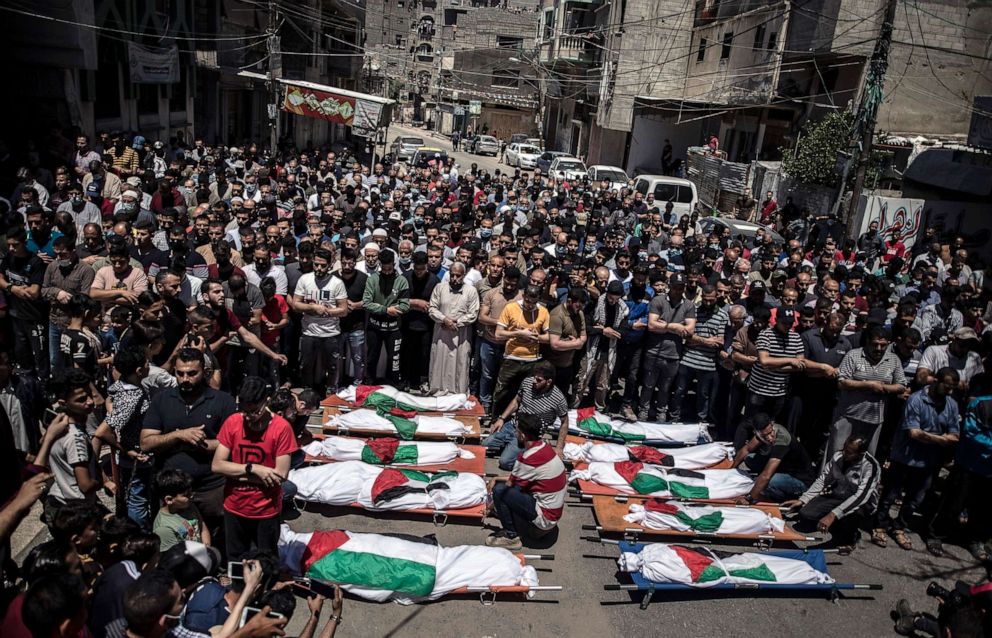 PHOTO: Palestinians attend the funeral of two women and eight children of the Abu Hatab family in Gaza City, who were killed after an Israeli air strike, May 15, 2021.