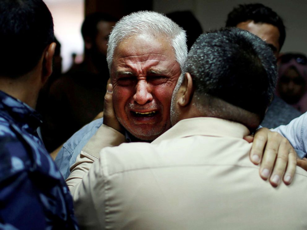 PHOTO: A relative of Palestinian Ahmed al-Rantisi, killed during a protest at the Israel-Gaza border, is consoled at a hospital in the northern Gaza Strip on May 14, 2018.