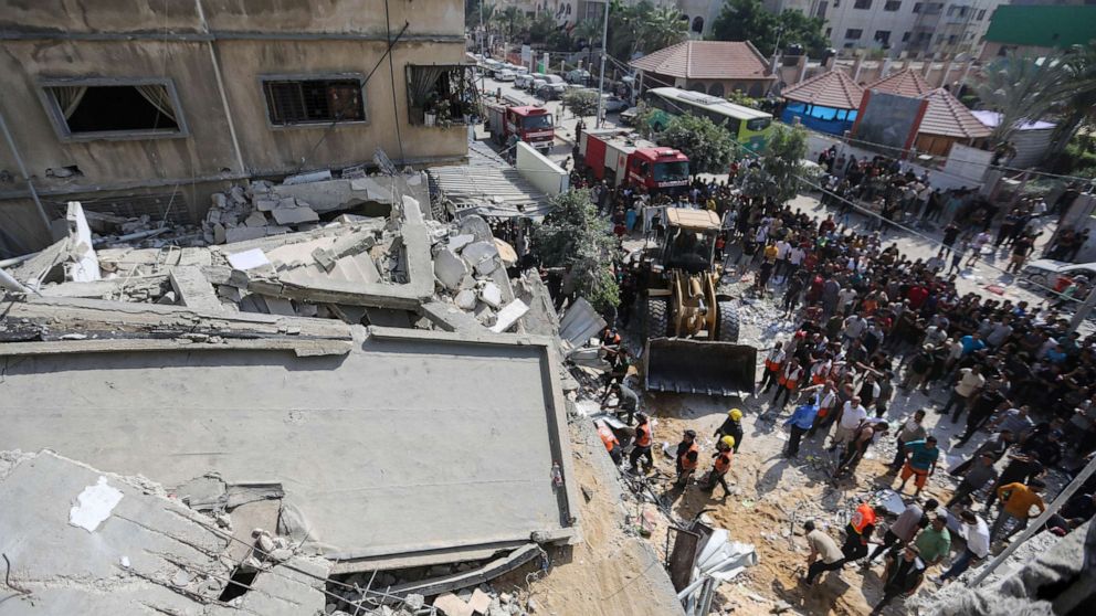 PHOTO: Palestinian emergency services and local citizens search for victims in buildings destroyed during Israeli air raids in the southern Gaza Strip on Oct. 24, 2023 in Khan Yunis, Gaza.