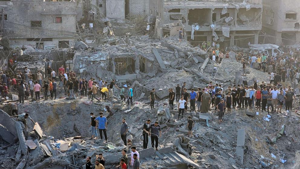 PHOTO: Palestinians search for casualties at the site of Israeli strikes on houses in Jabalia refugee camp in the northern Gaza Strip, Oct. 31, 2023.