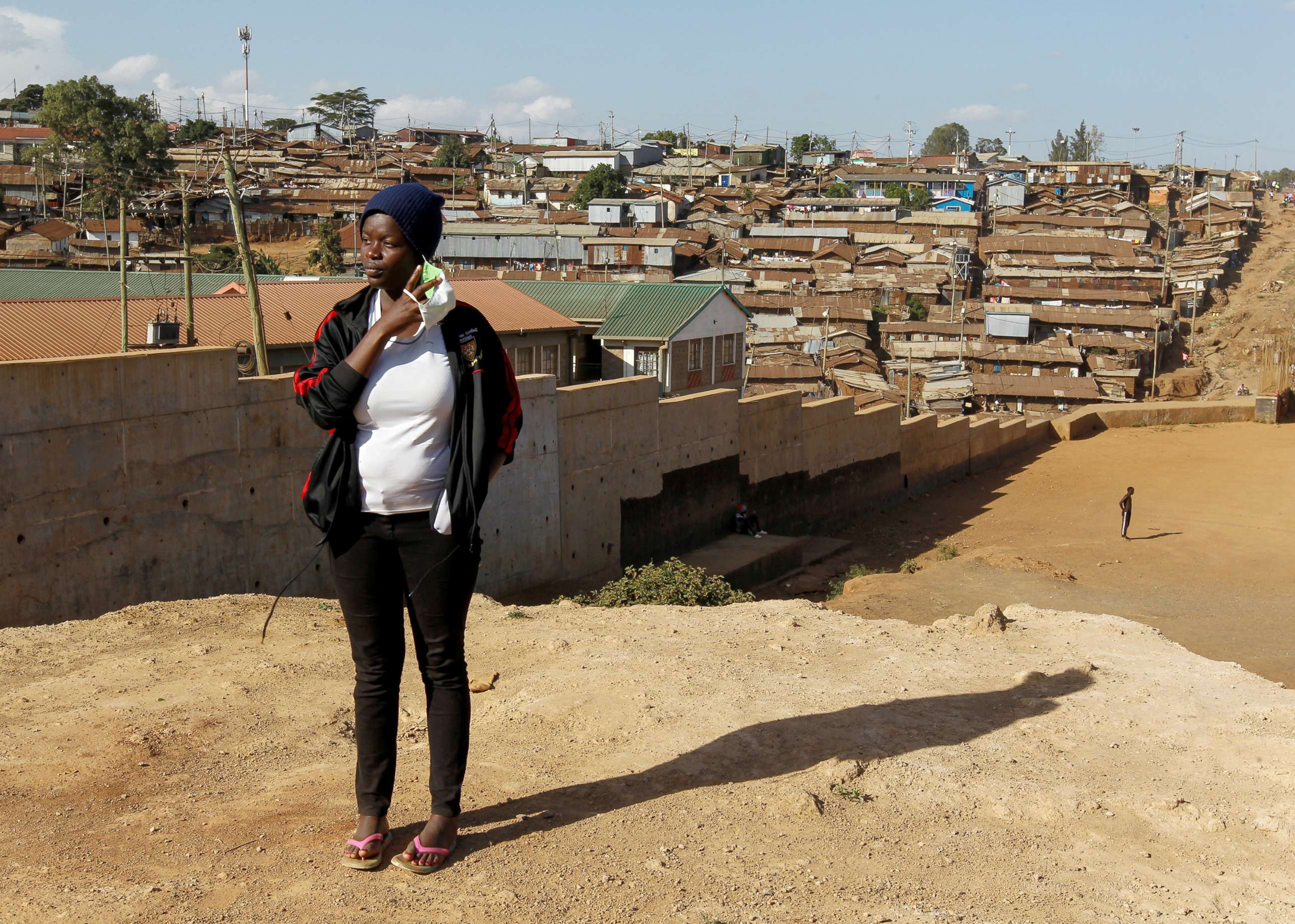 PHOTO: Jackline Bosibori, 17, a secondary school student, poses for a photograph within Lindi village of Kibera slums, in Nairobi, Kenya, Dec. 16, 2020. 