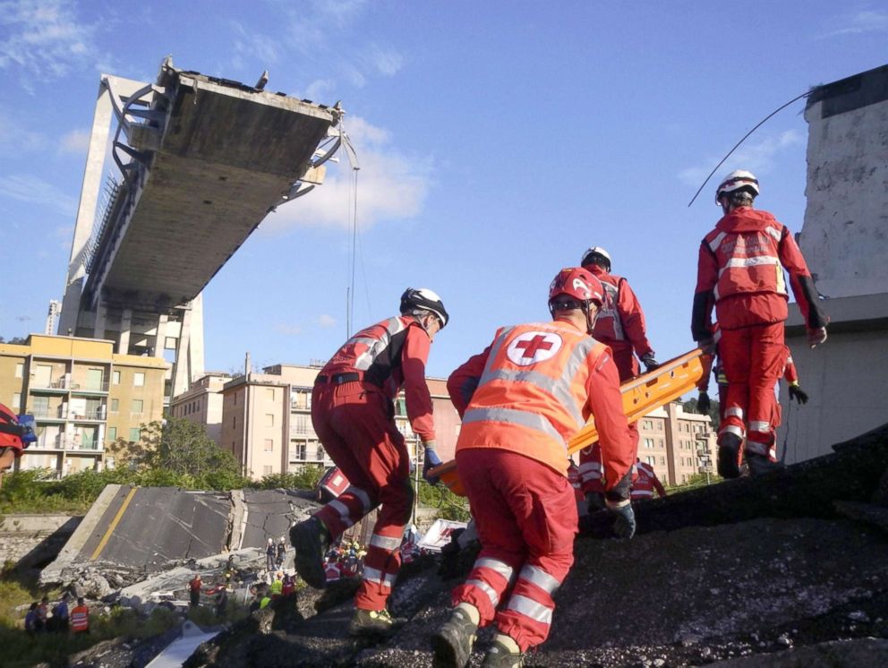 PHOTO: A handout photo made available by Italian Red Cross Press Office shows members of Italian Red Cross at work on the rubble of the partially collapsed Morandi bridge in Genoa, Italy, Aug. 16, 2018 (issued Aug. 17, 2018).