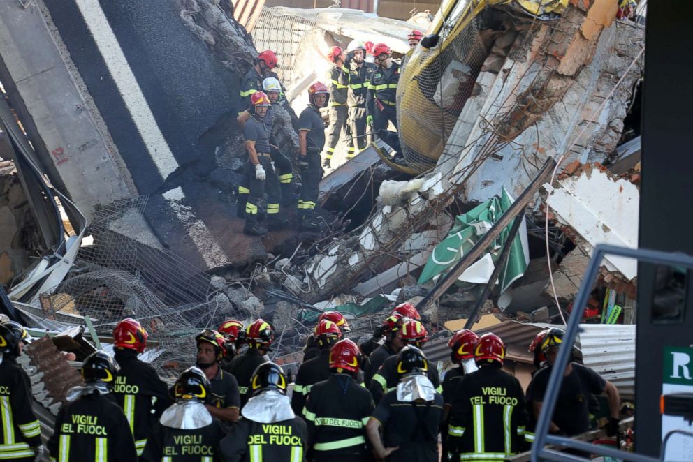 PHOTO: Rescue teams work among the rubble of the collapsed Morandi highway bridge over the A10 highway in Genoa, Italy, Aug. 14, 2018.