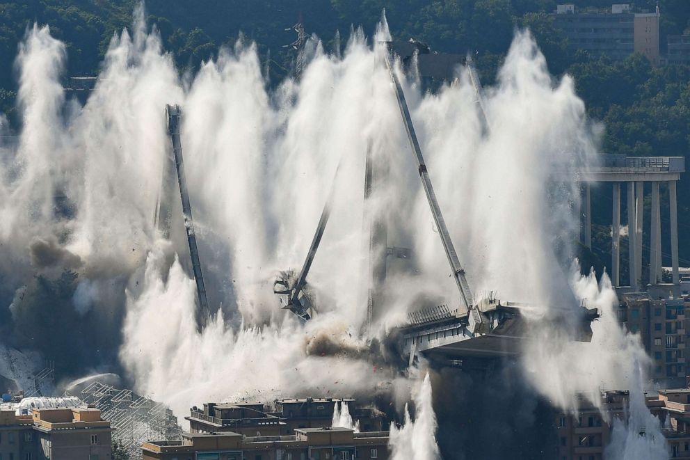 PHOTO: Explosive charges blow up the eastern pylons of Genoa's Morandi motorway bridge, June 28, 2019, in Genoa, Italy.