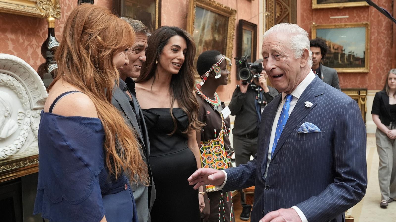 PHOTO: Britain's King Charles III speaks with, from left, Charlotte Tilbury, and George and Amal Clooney during a reception for the winners of the King's Trust Awards 2025 at Buckingham Palace, London, June 25, 2025.