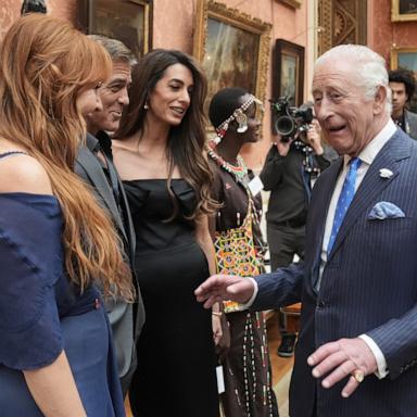 PHOTO: Britain's King Charles III speaks with, from left, Charlotte Tilbury, and George and Amal Clooney during a reception for the winners of the King's Trust Awards 2025 at Buckingham Palace, London, June 25, 2025. 