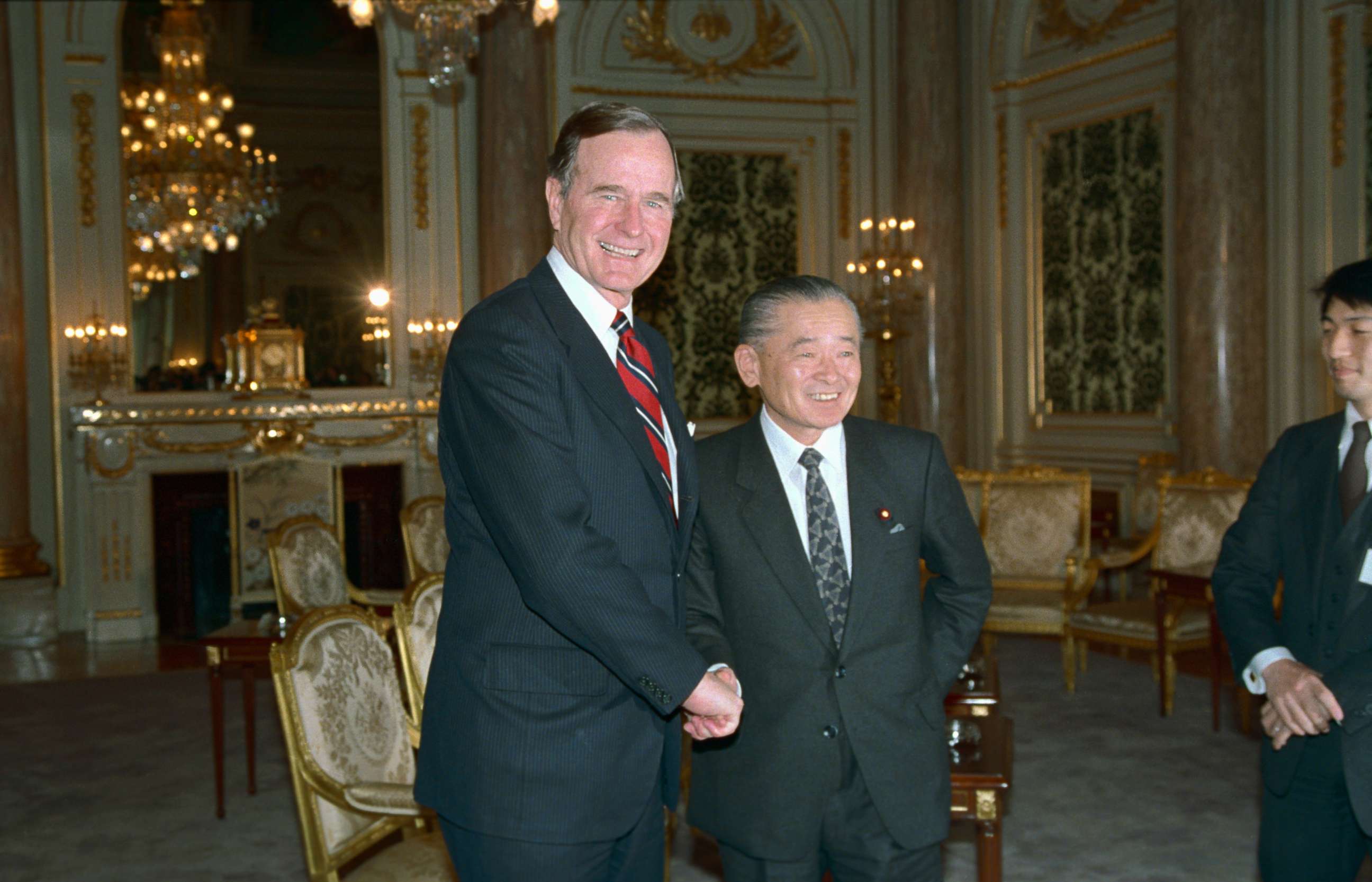 PHOTO: President George H.W. Bush is greeted by Japanese Prime Minister Noboru Takeshita, Feb. 23, 1989, after Bush arrived for tomorrow's funeral of Emperor Hirohito.