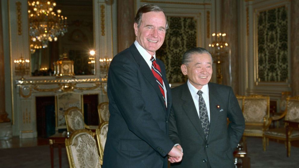 PHOTO: President George H.W. Bush is greeted by Japanese Prime Minister Noboru Takeshita, Feb. 23, 1989, after Bush arrived for tomorrow's funeral of Emperor Hirohito.