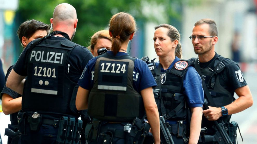 German armed police talk near the scene after they have sealed off a primary school and the surrounding area due to a potentially "dangerous situation," in Berlin, June 5, 2018.