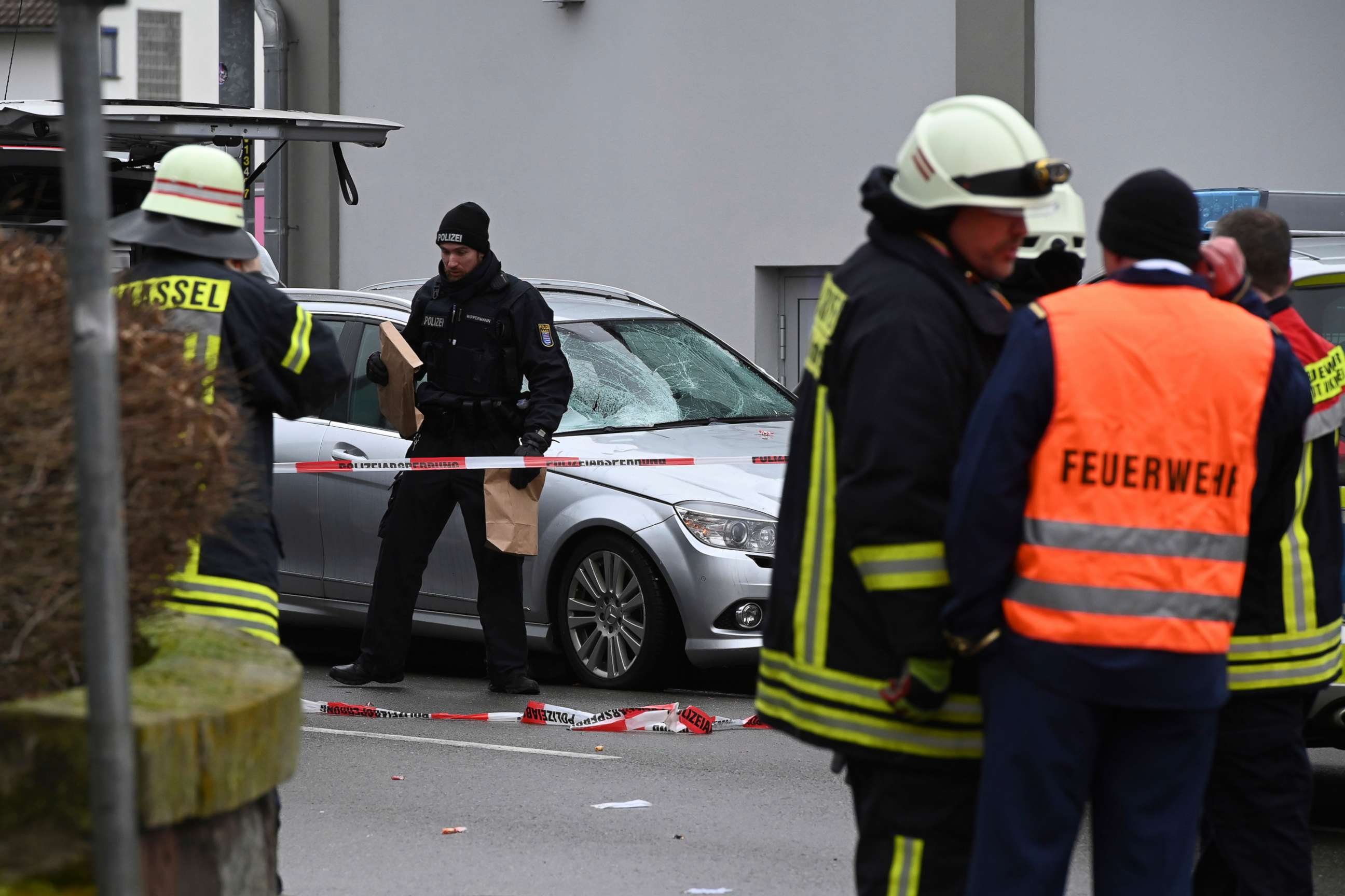 PHOTO: Police and rescue workers stand next to the scene of the accident with a car that is said to have crashed into a carnival parade in Volkmarsen, central Germany, Feb. 24, 2020. 
