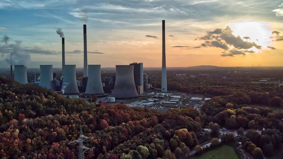 PHOTO: The sun sets behind the coal-fired power plant 'Scholven' of the Uniper energy company in Gelsenkirchen, Germany, on Oct. 22, 2022.