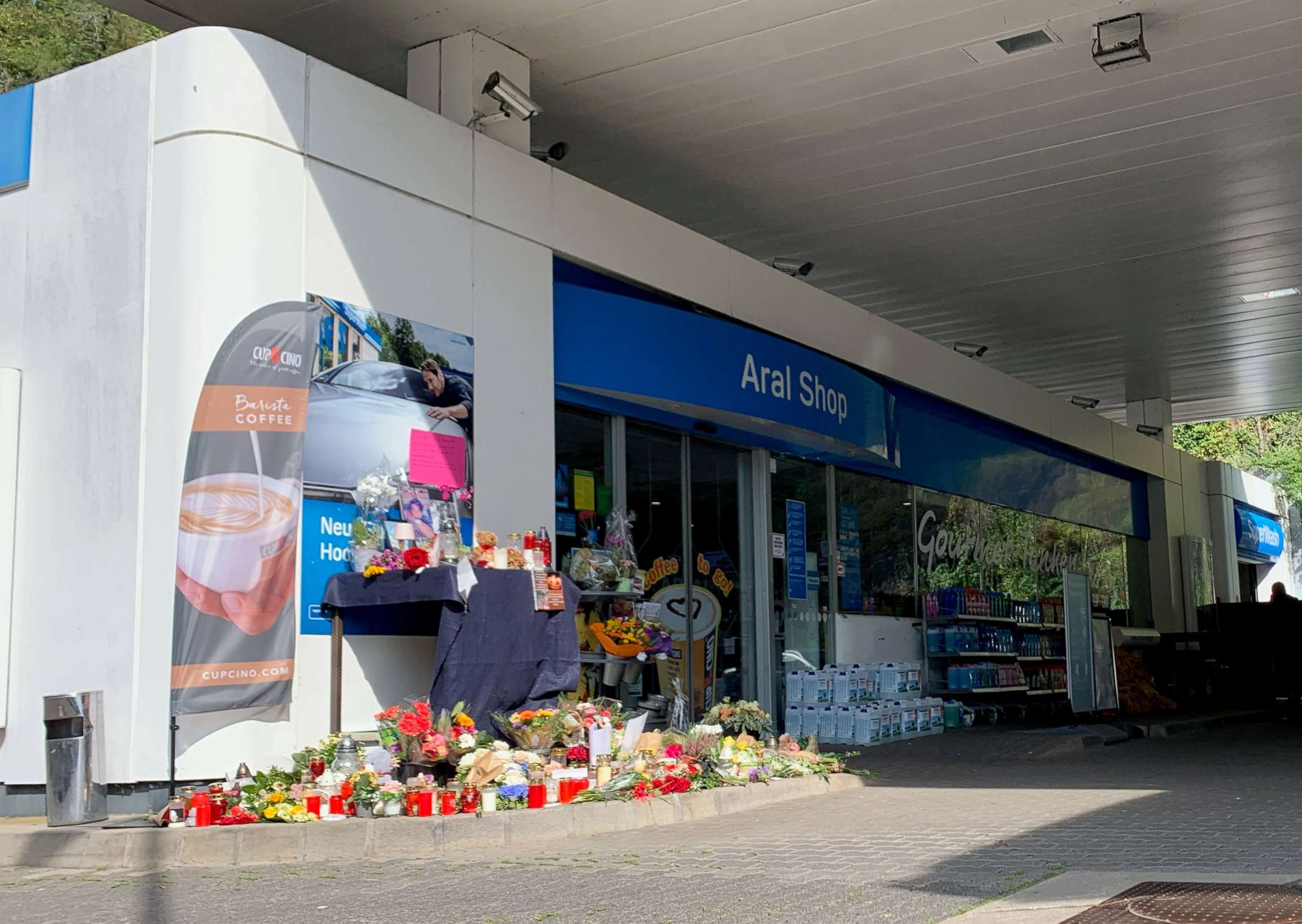 PHOTO: Flowers are placed in front of a gas station in Idar-Oberstein, Germany, Sept. 21, 2021.