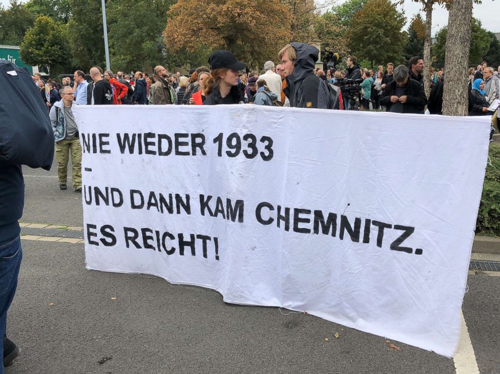 PHOTO: Protesters in an an anti-violence counter-demonstration hold up a sign "Never again 1933. And then there was Chemnitz" - a reference to Nazi-era Germany in Chemnitz, Germany, Sept. 1, 2018.