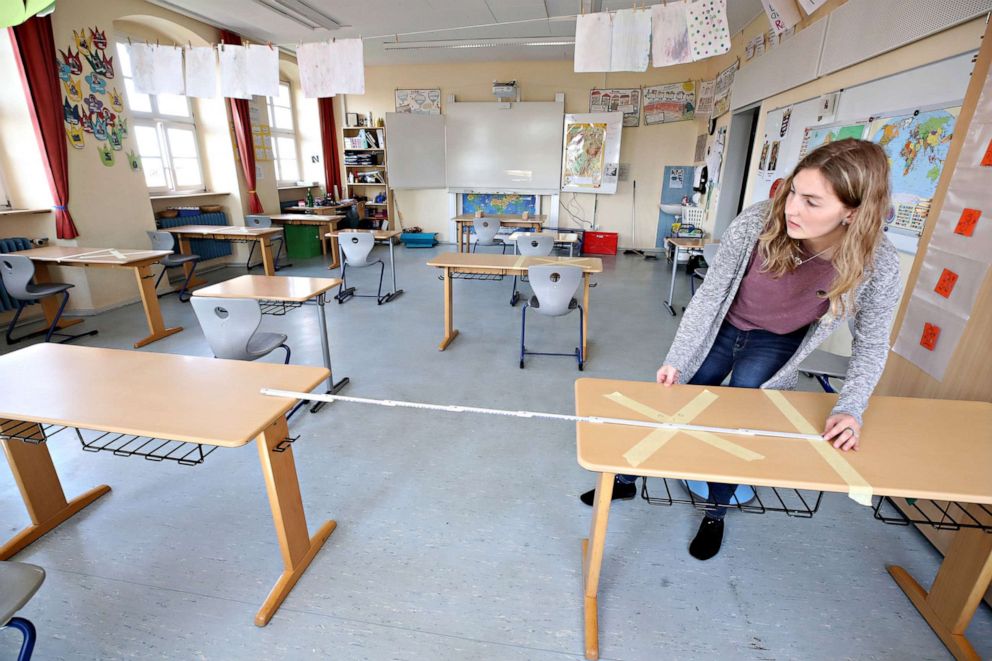 PHOTO:Staff tape off social-distancing markings as they prepare to reopen Schloss-Schule elementary school, April 21, 2020, in Heppenheim, Germany.