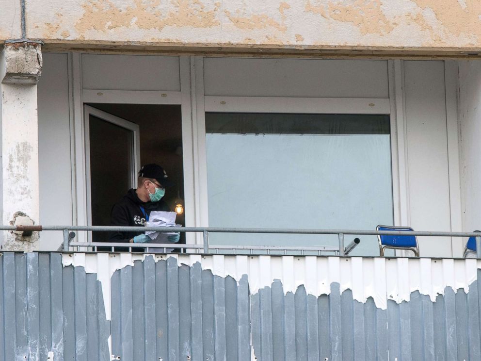PHOTO: A police officer seizes a pile of papers on the balcony of a suspect during raids in Schwerin, Germany, Oct. 31, 2017. German authorities arrested a 19-year-old Syrian citizen for allegedly planning a bomb attack.