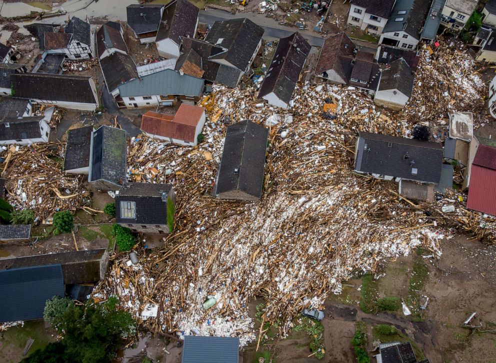 PHOTO: Debris of houses and trees surround houses in Schuld, Germany, July 16, 2021.