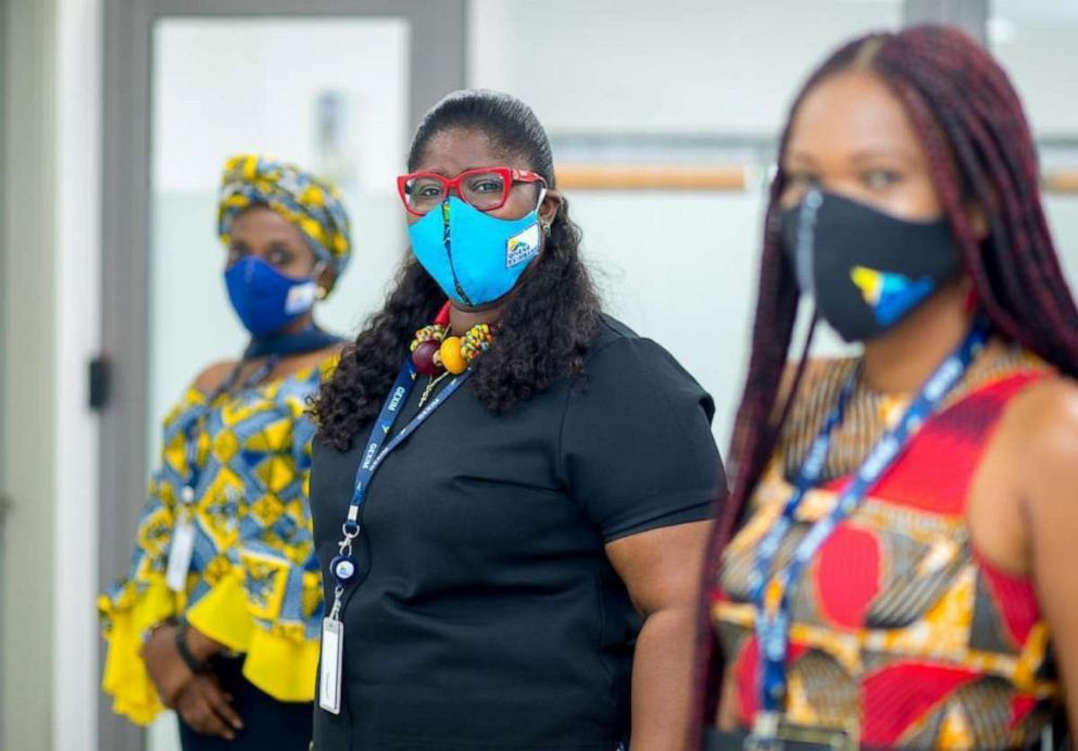 PHOTO: Employees of Ghana EXIM Bank are seen wearing protective face masks with the company’s logo, custom made by Heritage Masks, in May 2020.