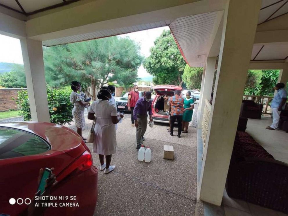 PHOTO: The descendants of Duodua Fie deliver a donation of protective face masks made by Heritage Masks as well as latex gloves and hand sanitizer to Kyebi Government Hospital in Ghana’s Eastern Region in April 2020, amid the coronavirus pandemic.
