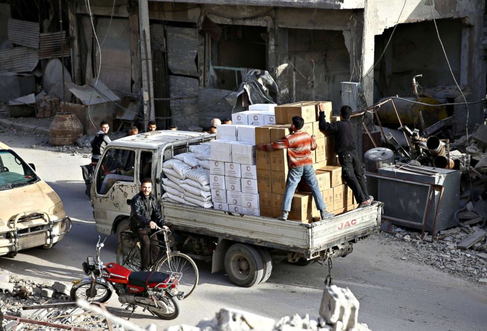 PHOTO: A pick-up truck loaded with humanitarian aid arrives at the besieged town of Douma, Eastern Ghouta, Damascus, Syria on March 5, 2018. 