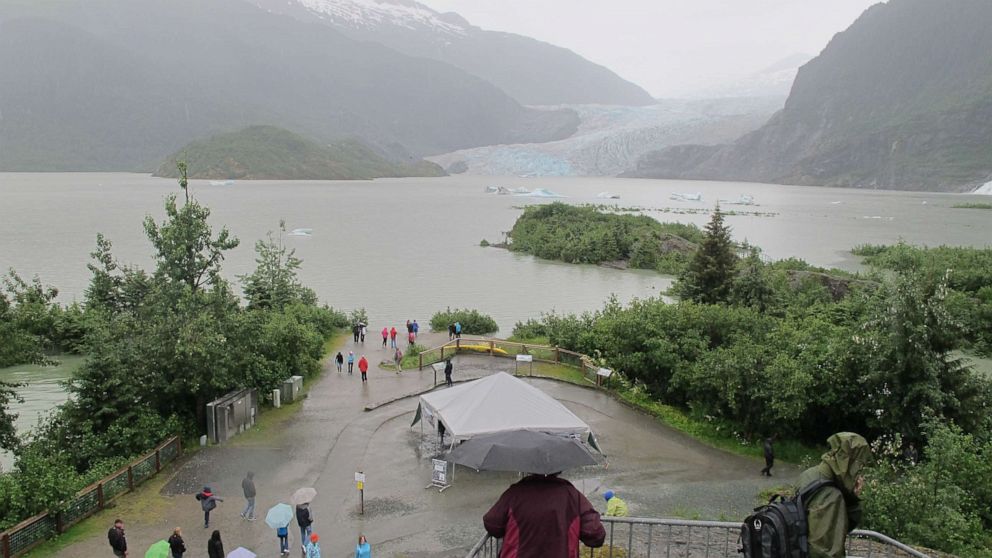 PHOTO: A bloated Mendenhall Lake submerges walking trails and beach areas popular with tourists in summer on July 11, 2014, in Juneau, Alaska, after glacial outburst flood warnings.
