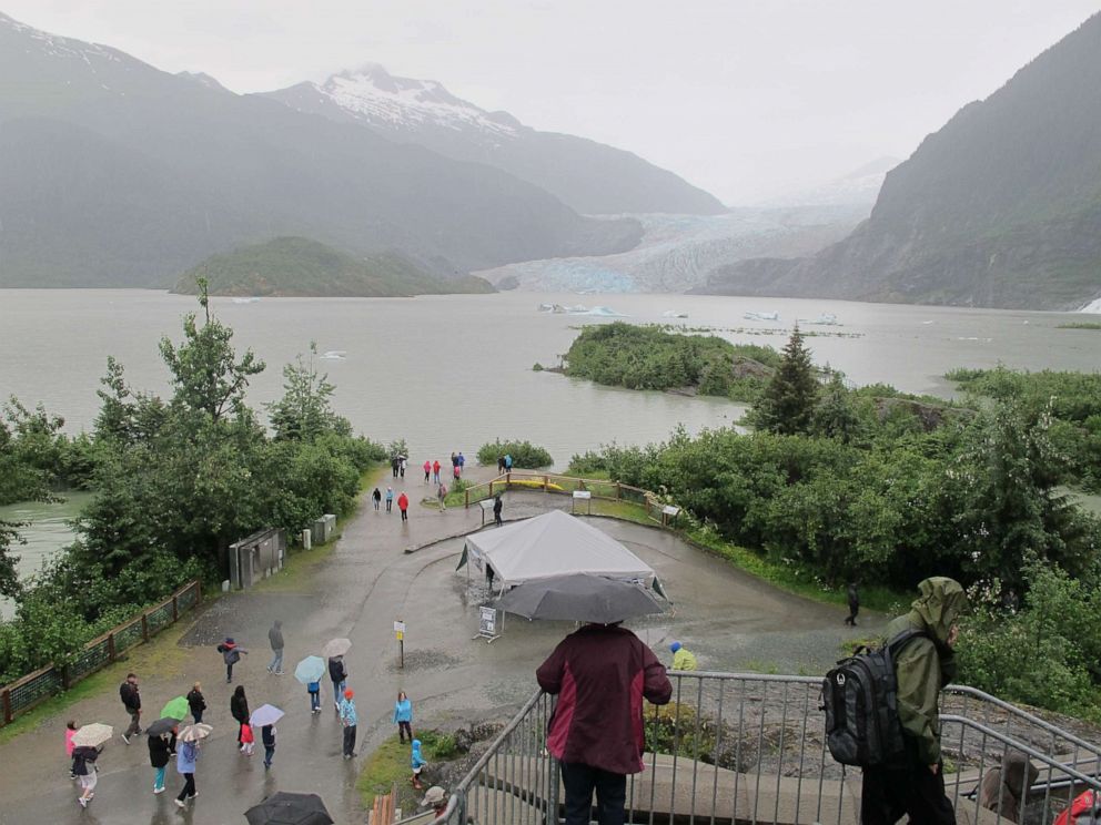 PHOTO: A bloated Mendenhall Lake submerges walking trails and beach areas popular with tourists in summer on July 11, 2014, in Juneau, Alaska, after glacial outburst flood warnings.