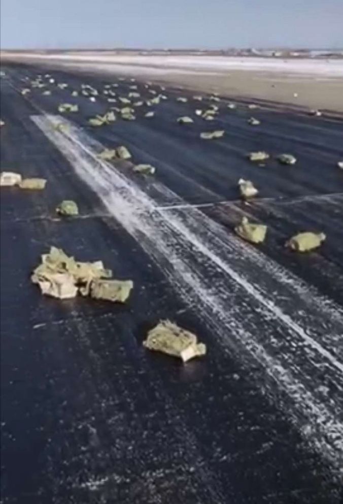 PHOTO: A plane carrying tons of precious gold-silver bars littered a runway in Russia and the surrounding area with its cargo, March 15, 2018, after part of the plane ripped off during takeoff, according to Russian media and a local official.