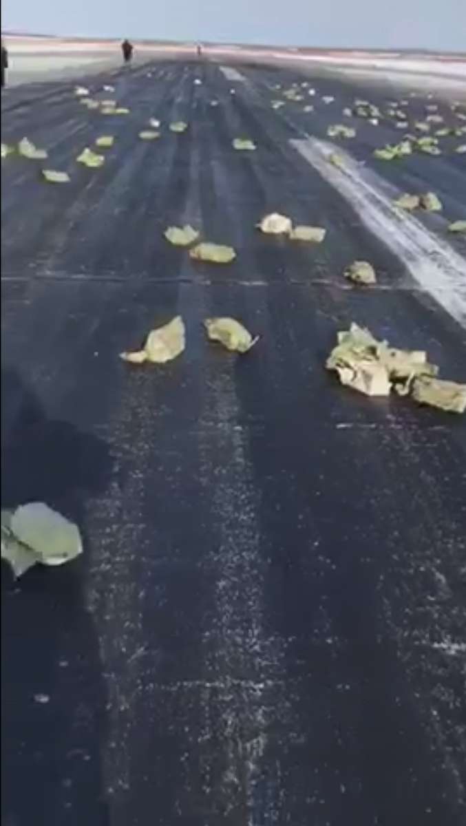 PHOTO: A plane carrying tons of precious gold-silver bars littered a runway in Russia and the surrounding area with its cargo, March 15, 2018, after part of the plane ripped off during takeoff, according to Russian media and a local official.