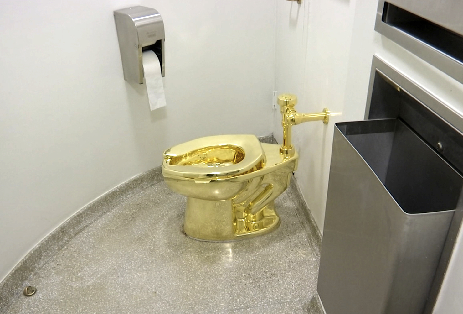 PHOTO: FILE - This Sept. 16, 2016 file image made from a video shows the 18-karat toilet, titled "America," by Maurizio Cattelan in the restroom of the Solomon R. Guggenheim Museum in New York.
