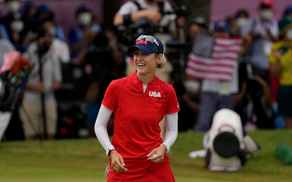PHOTO: Nelly Korda, of the United States, celebrates after winning the gold medal on the 18th hole during the final round of the women's golf event at the 2020 Summer Olympics, Aug. 7, 2021, at the Kasumigaseki Country Club in Kawagoe, Japan.