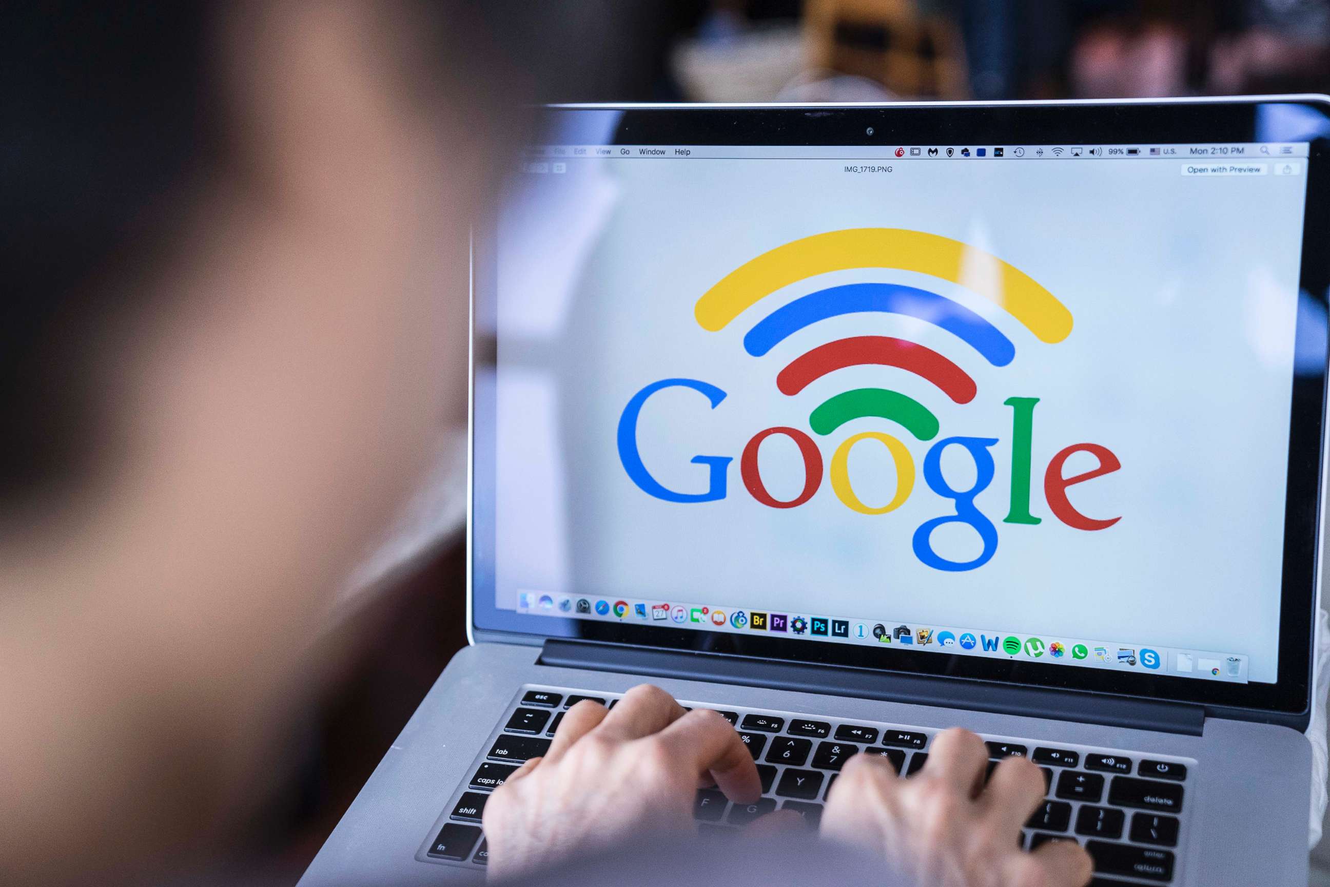 PHOTO: A woman uses a Macbook Pro with Google logo on the screen in Hong Kong, Nov. 27, 2017.