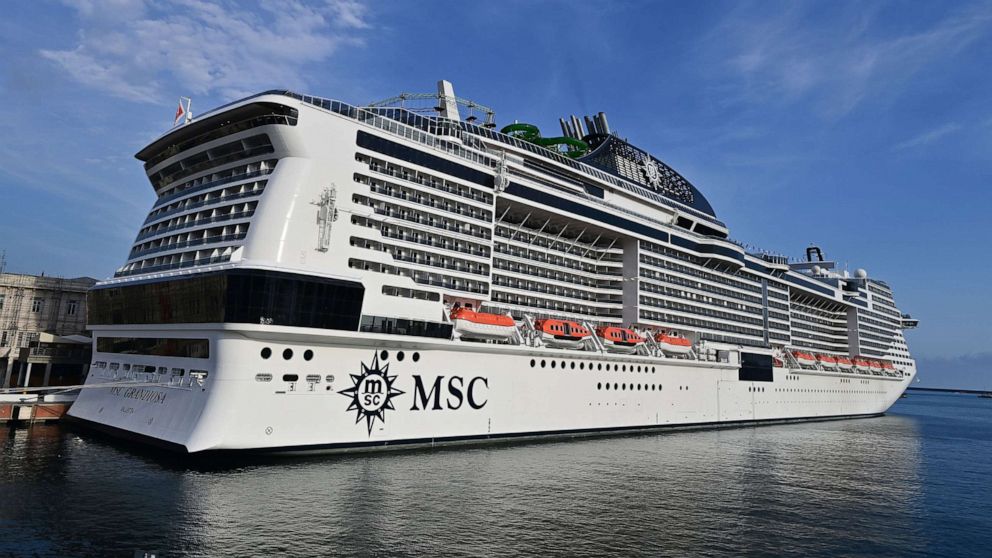 PHOTO: A picture taken in the northern Italian port of Genoa on Aug. 16, 2020, shows the MSC Grandiosa cruise liner leaving the port pulled by a little boat after six-and-half months of inactivity due to the COVID-19 pandemic.
