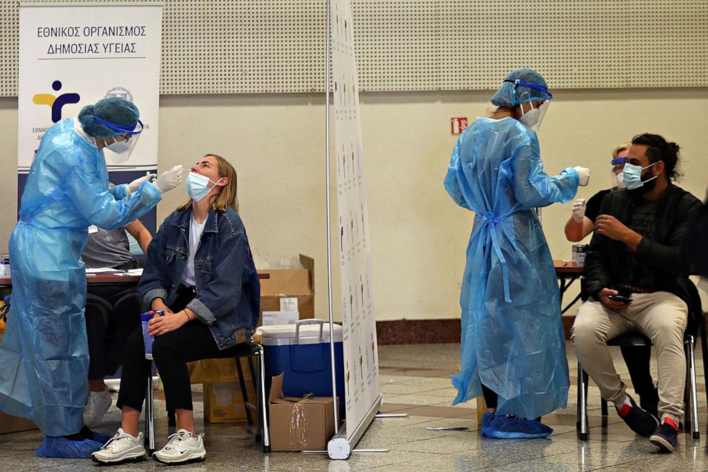 PHOTO: Medical personnel wearing collect Rapid test swab samples for COVID-19 in a metro station in Athens, Oct. 20,  2020.