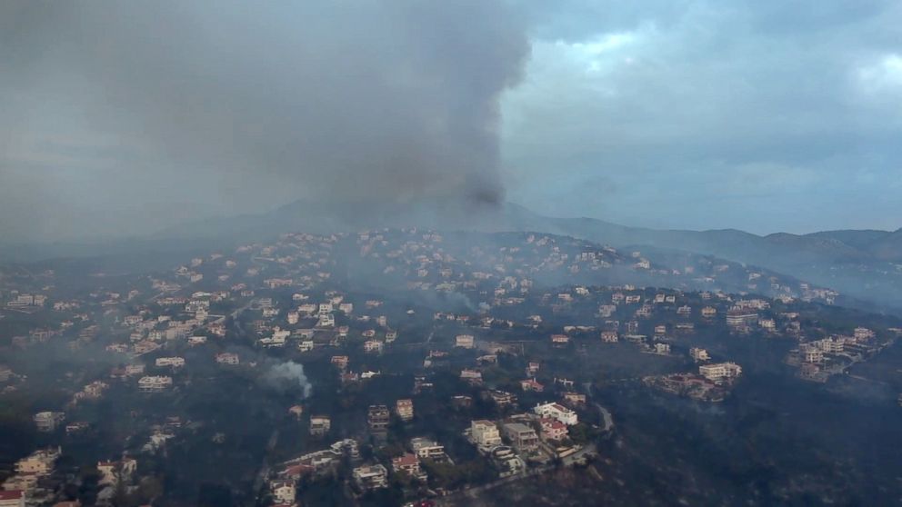 PHOTO: This handout picture released by the Hellenic Ministry of Defense on July 24, 2018 shows an aerial view of the fire in Mati, Greece.