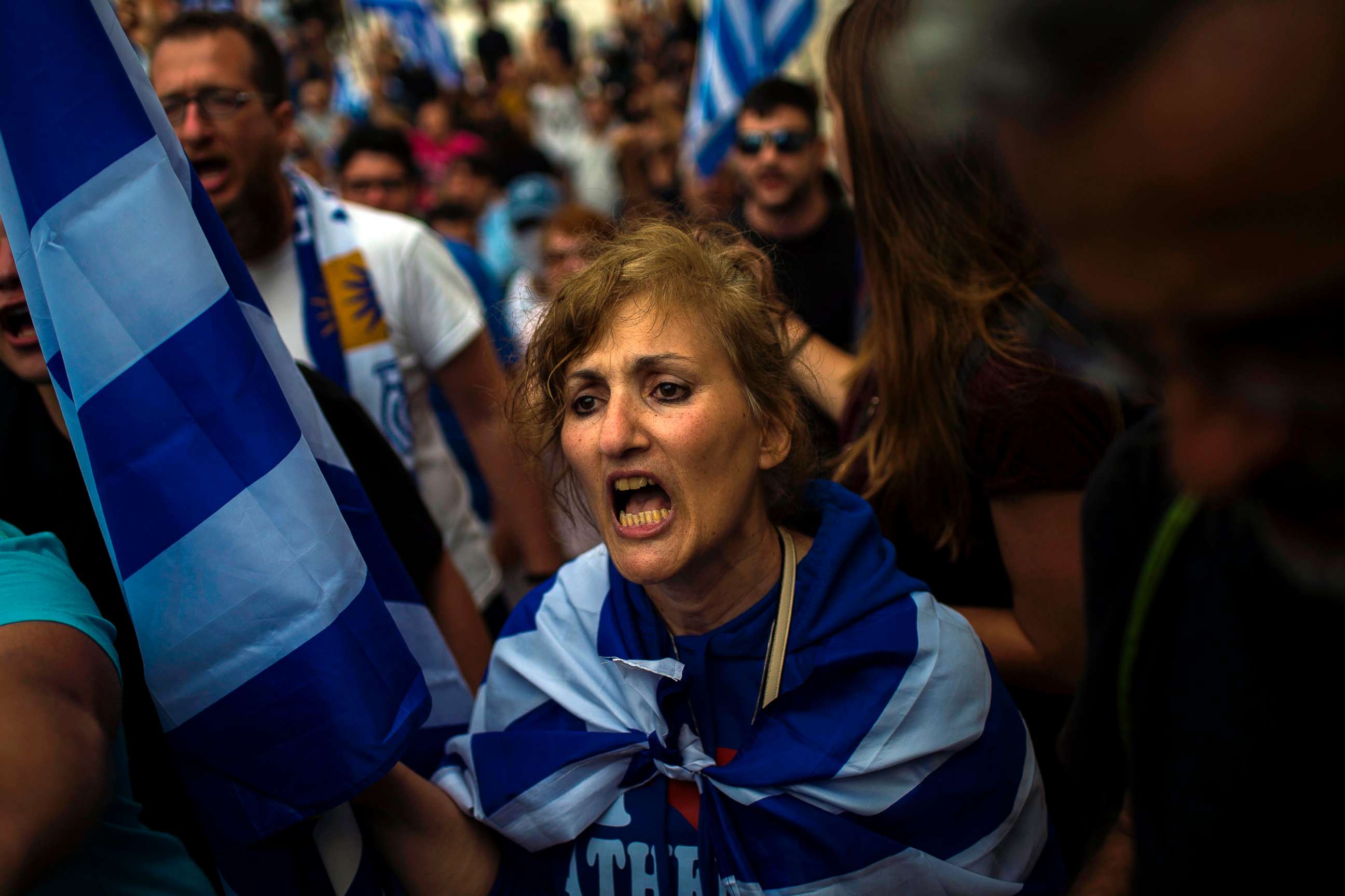 PHOTO: A woman shouts in a demonstration against the agreement reached to resolve a 27-year name row with Macedonia in Athens, Greece, June 16, 2018.