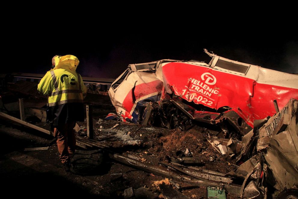 PHOTO: A man walks at the site of a crash, where two trains collided, near the city of Larissa, Greece, March 1, 2023.