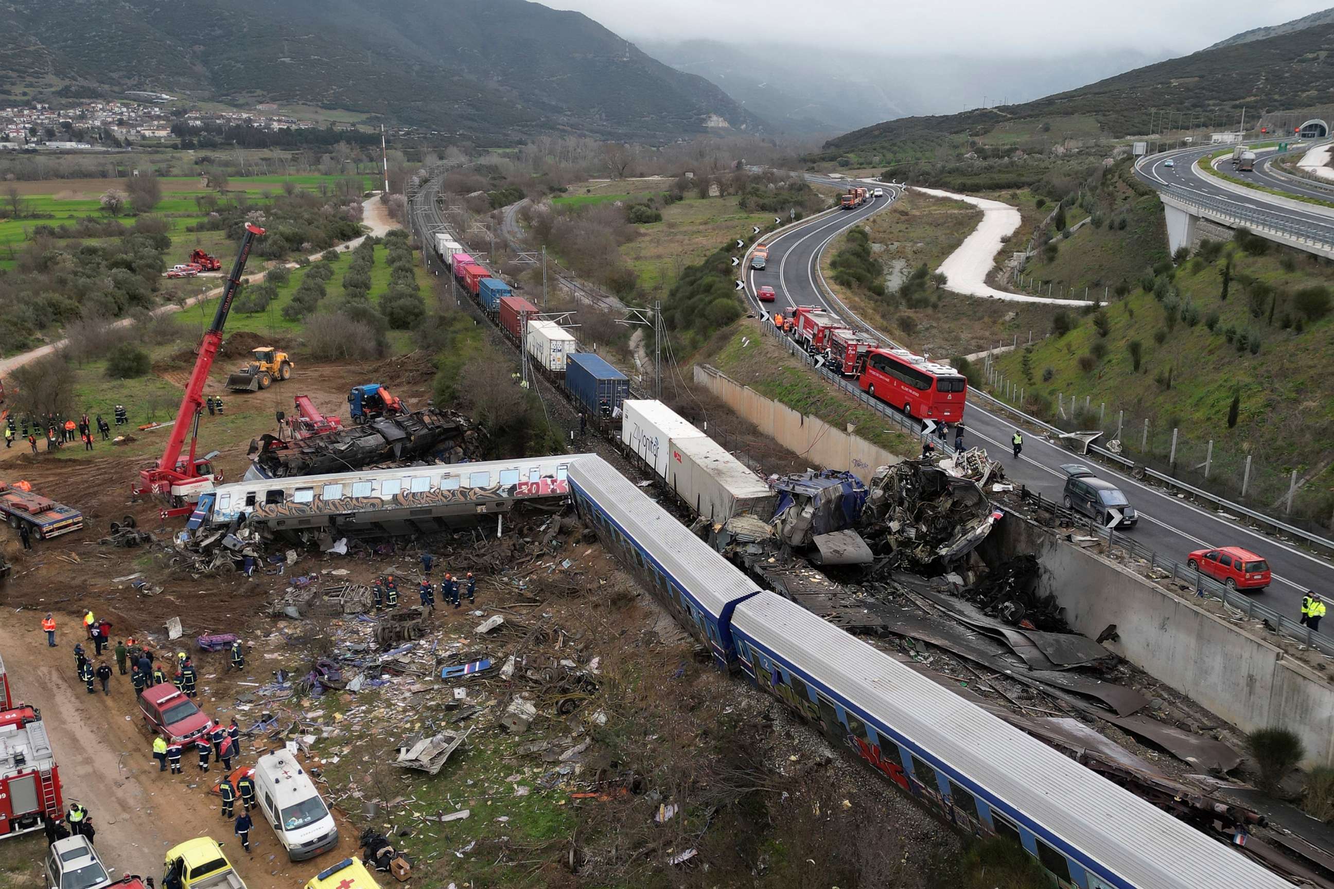 PHOTO: A crane, firefighters and rescuers operate after a collision in Tempe near Larissa city, Greece, March 1, 2023.