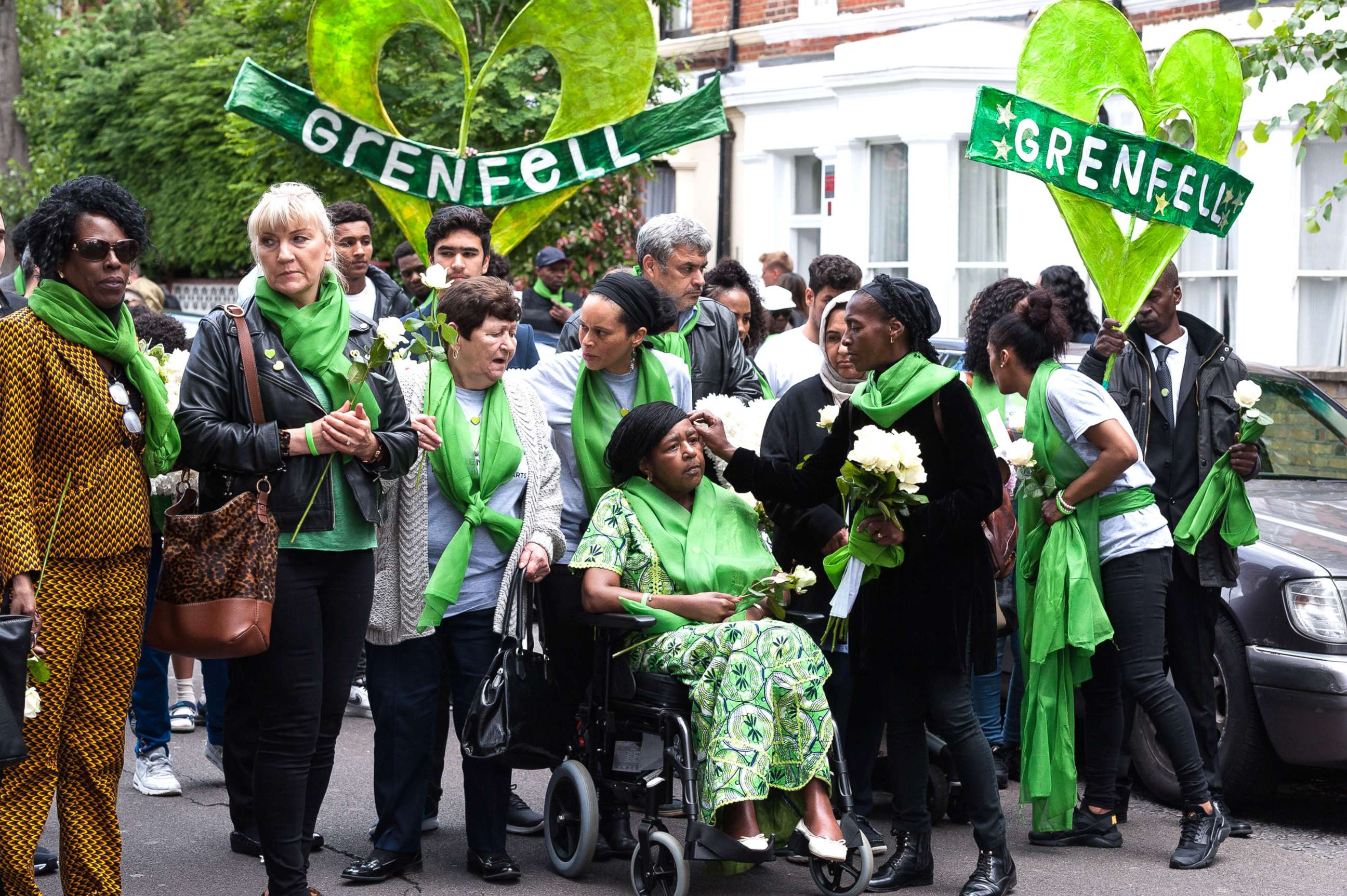 PHOTO: Survivors, bereaved families, members of the public and community leaders march from St. Helen's Church in North Kensington to the base of the Grenfell Tower during the 'Humanity for Grenfell' commemorations, June 14, 2019 in London. 