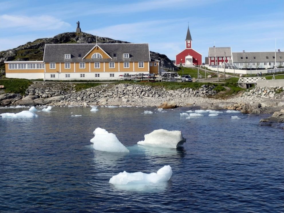 PHOTO: Small pieces of ice float in the water off the shore in Nuuk, Greenland, June 13, 2019.