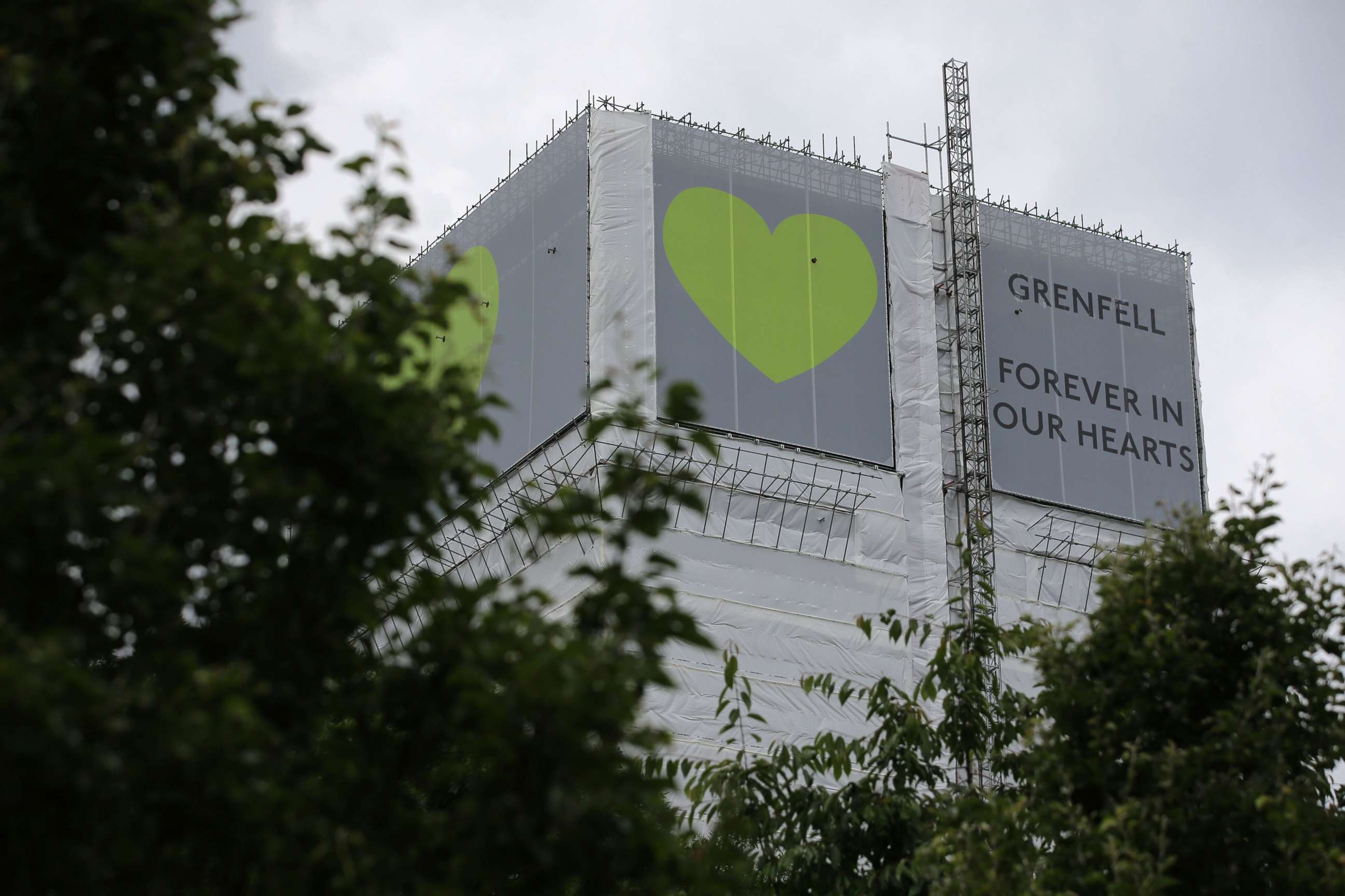 PHOTO: A sign in support of the victims of the Grenfell fire covers Grenfell Tower near Ladbroke Grove, west London on June 13, 2018.