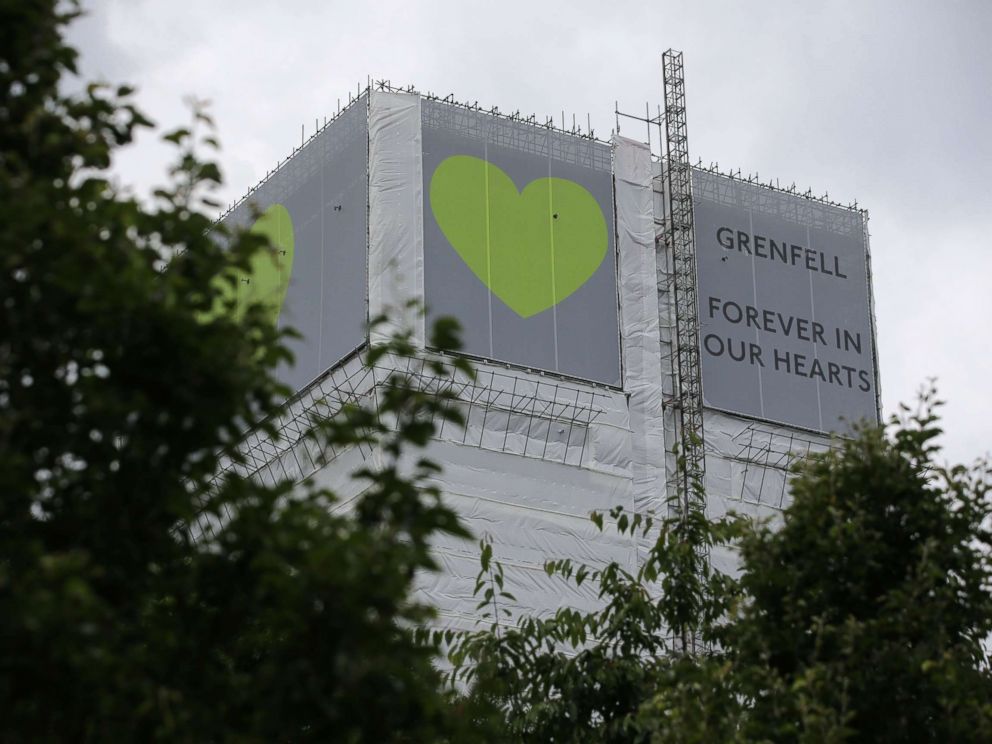 PHOTO: A sign in support of the victims of the Grenfell fire covers Grenfell Tower near Ladbroke Grove, west London on June 13, 2018.