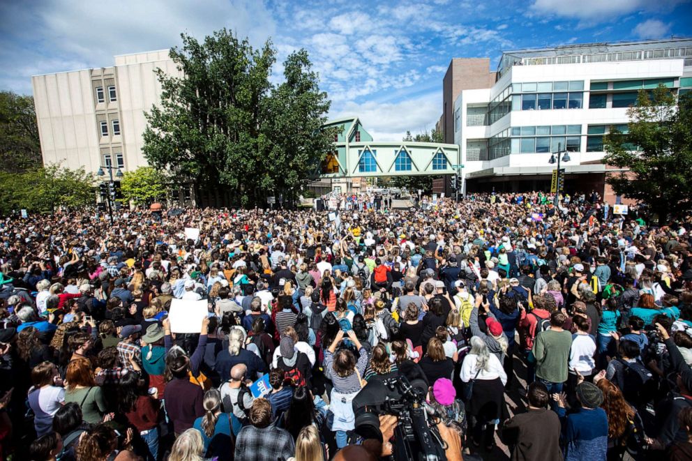 PHOTO: Climate activist Greta Thunberg walks on stage during the "Town-Gown Climate Accord" hosted by the Iowa City Climate Strikers, Oct., 4, 2019, in downtown Iowa City, Iowa.