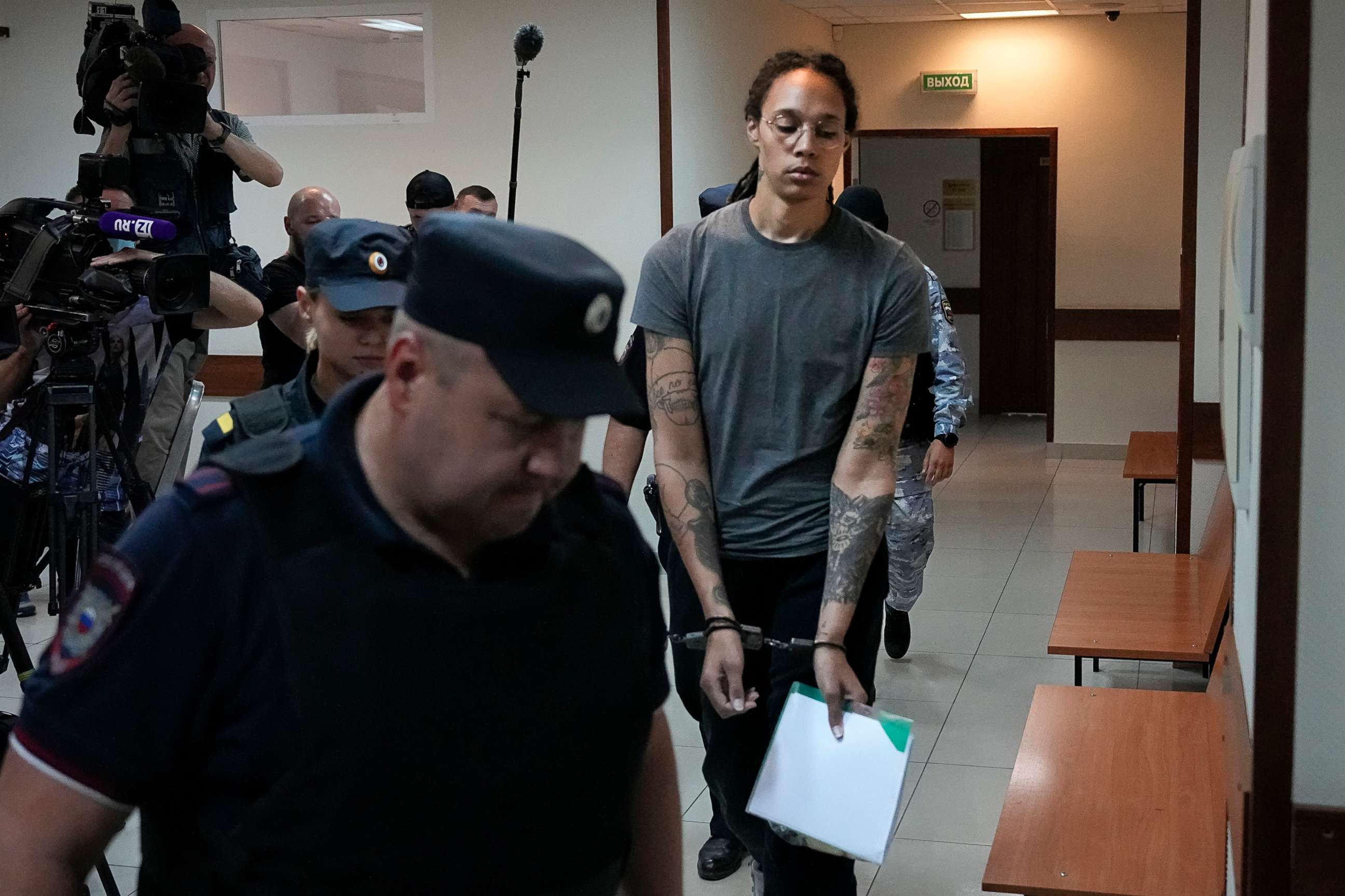 PHOTO: Brittney Griner is escorted in a court room prior to a hearing, in Khimki, Russia, Aug. 4, 2022.