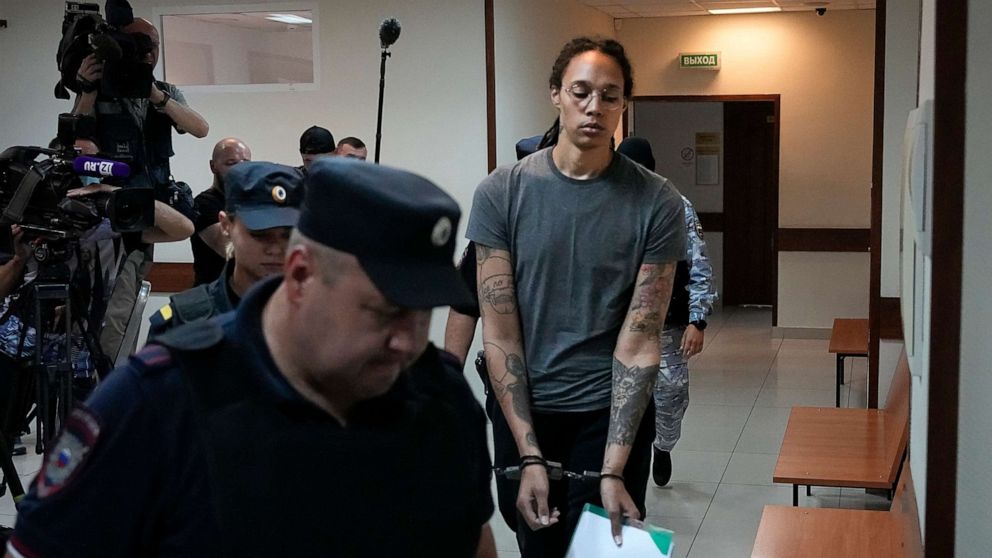 PHOTO: Brittney Griner is escorted in a court room prior to a hearing, in Khimki, Russia, Aug. 4, 2022.