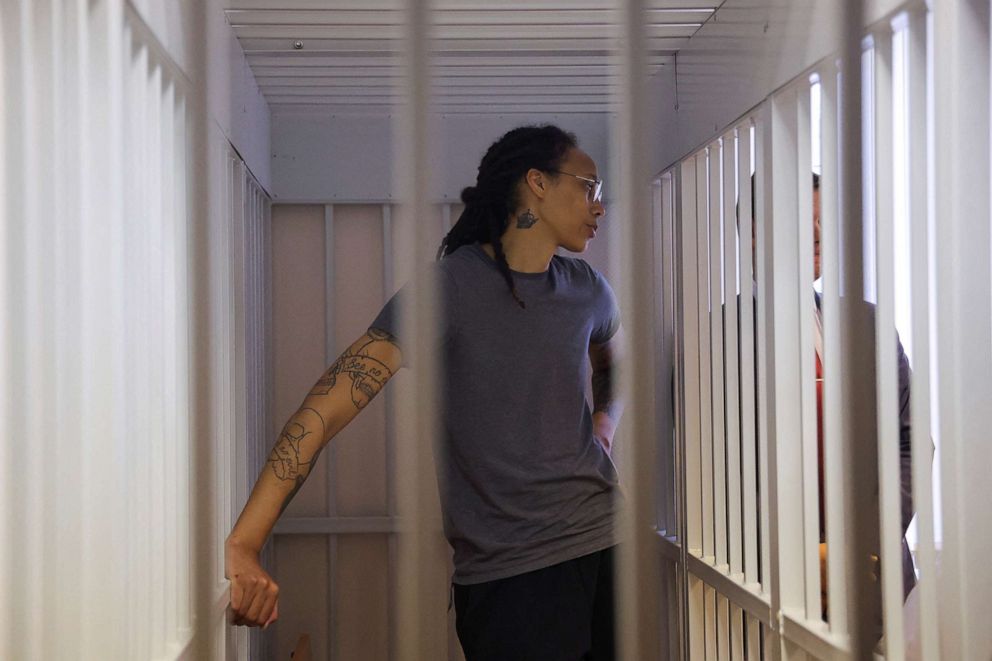 PHOTO: Brittney Griner stands inside a defendants' cage during the reading of the court's verdict in Khimki, Russia, Aug. 4, 2022.