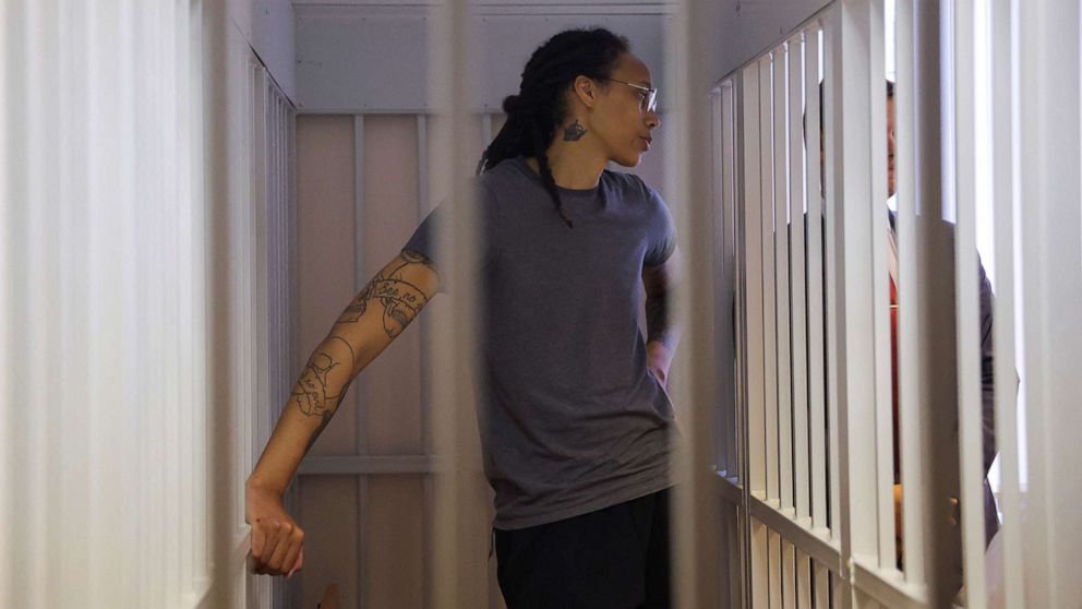 PHOTO: Brittney Griner stands in a cage for the accused during the reading of the verdict in a court in Khimki, Russia, on August 4, 2022.