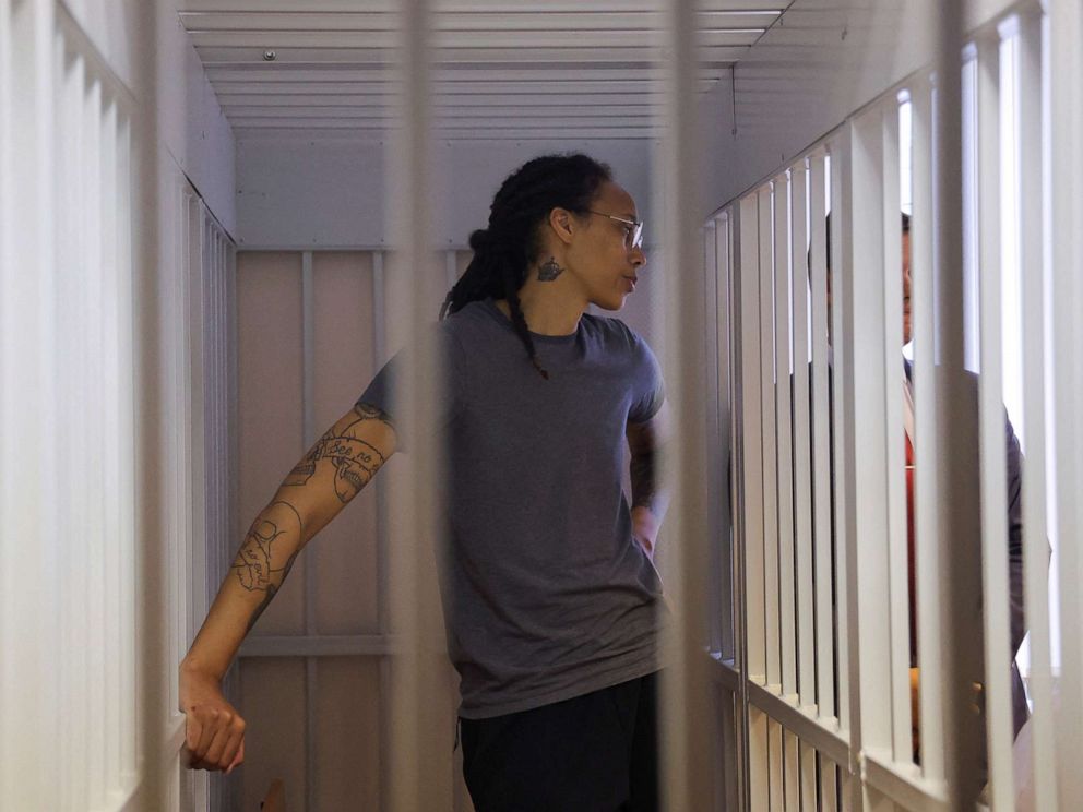 PHOTO: Brittney Griner stands inside a defendants cage during the reading of the courts verdict in Khimki, Russia, Aug. 4, 2022.