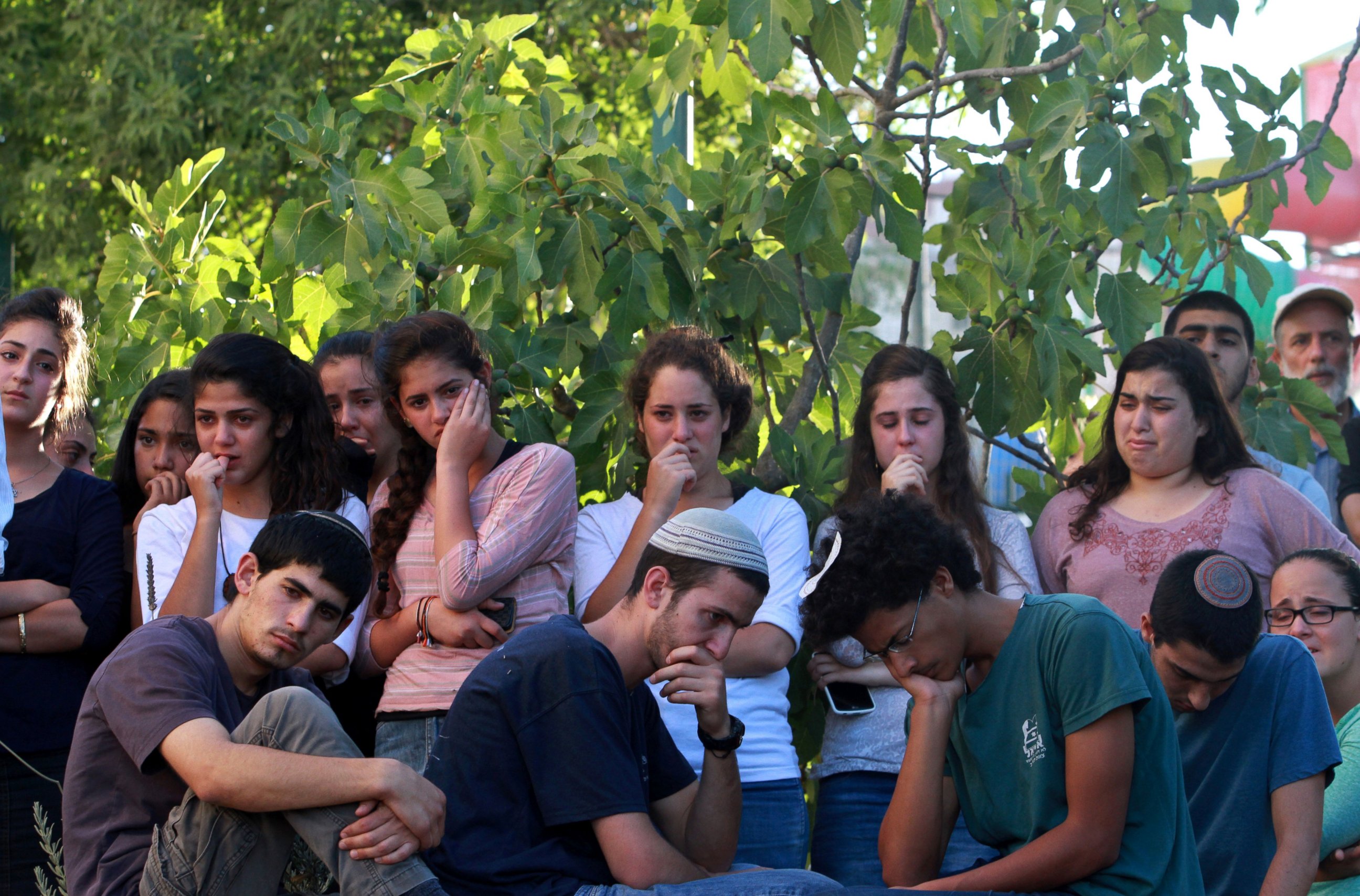 PHOTO: Friends and relatives of Israeli Hallel Yaffa Ariel, a 13-year-old girl who was fatally stabbed by a Palestinian attacker in her home, mourn during her funeral in Kiryat Arba, outside the West Bank city of Hebron on June 30, 2016.